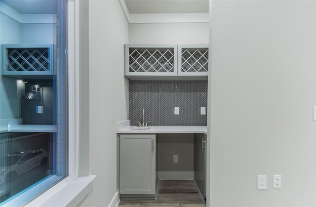 3325 Norris St, Plano, TX 75074 - indoor wet bar with light wood-style floors and decorative backsplash