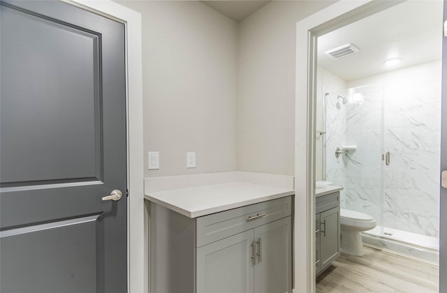 3325 Norris St, Plano, TX 75074 - full bath featuring a marble finish shower, vanity, toilet, and wood finished floors