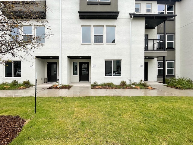 3325 Norris St, Plano, TX 75074 - townhome / multi-family property with brick siding and a front lawn