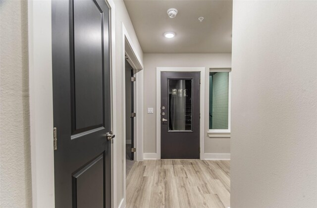 3325 Norris St, Plano, TX 75074 - hall featuring light wood-style floors and baseboards
