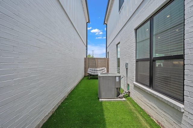 238 Estates Cir, College Station, TX 77840 - view of side of property featuring cooling unit and board and batten siding