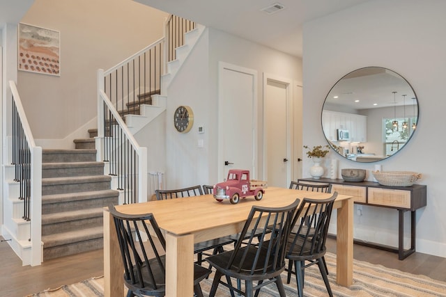 238 Estates Cir, College Station, TX 77840 - dining area with stairs, wood finished floors, and recessed lighting