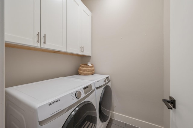 238 Estates Cir, College Station, TX 77840 - clothes washing area with washing machine and dryer, cabinet space, baseboards, and tile patterned floors