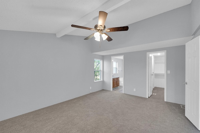3355 La Mesa Dr, Weatherford, TX 76085 - unfurnished bedroom with light colored carpet, a spacious closet, ensuite bathroom, a ceiling fan, and a closet