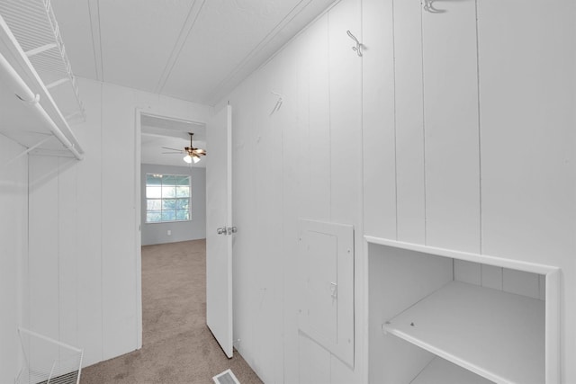 3355 La Mesa Dr, Weatherford, TX 76085 - walk in closet with carpet flooring and a ceiling fan