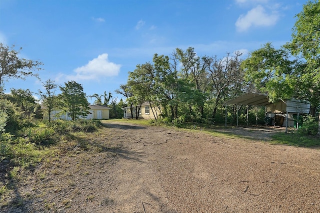 3355 La Mesa Dr, Weatherford, TX 76085 - view of yard featuring driveway and a detached carport