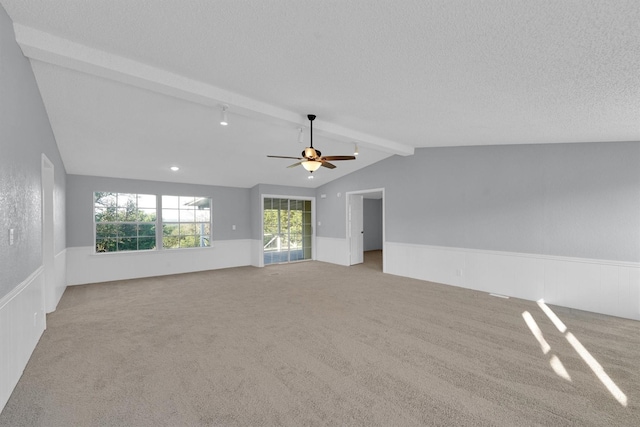 3355 La Mesa Dr, Weatherford, TX 76085 - unfurnished room with carpet flooring, a wainscoted wall, a ceiling fan, and a textured ceiling