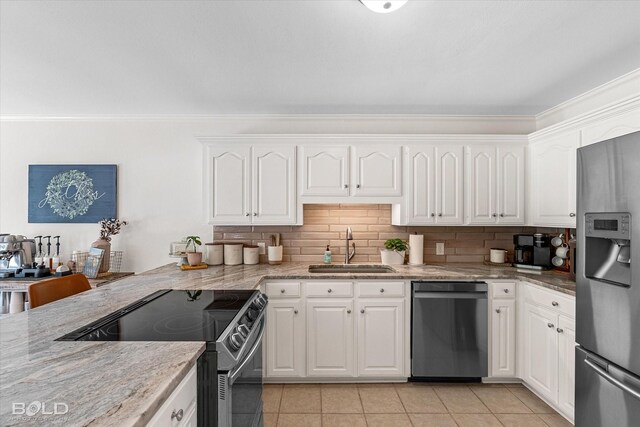 7622 Mary Ann Cir, Blanchard, LA 71107 - kitchen featuring appliances with stainless steel finishes, a sink, light tile patterned floors, white cabinetry, and ornamental molding
