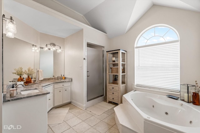 7622 Mary Ann Cir, Blanchard, LA 71107 - bathroom with vaulted ceiling, a shower stall, a jetted tub, double vanity, and tile patterned flooring