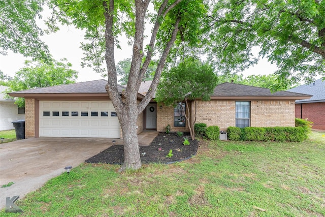 3526 Carnation Ct, Abilene, TX 79606 - view of front of home featuring brick siding, an attached garage, concrete driveway, and a front lawn