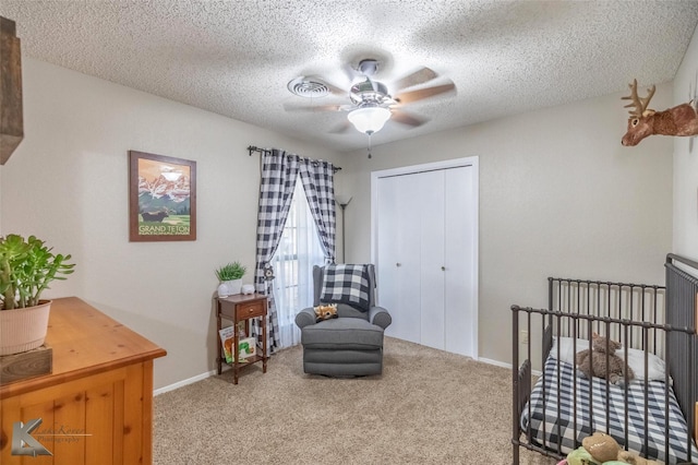 3526 Carnation Ct, Abilene, TX 79606 - bedroom with carpet floors, a closet, a textured ceiling, ceiling fan, and baseboards