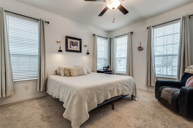 1252 Milfoil Dr, Justin, TX 76247 - bedroom with light carpet, baseboards, and ceiling fan