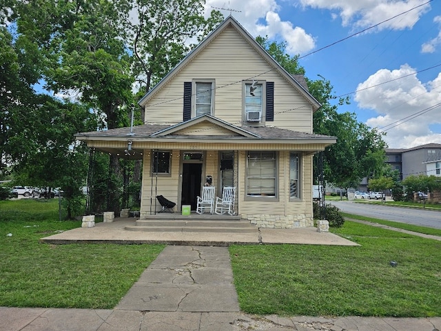1801 S 10th St S Unit A & B, Waco, TX 76706 - view of front of property with a porch, a front yard, and a shingled roof