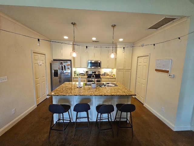 1801 S 10th St S Unit A & B, Waco, TX 76706 - kitchen featuring appliances with stainless steel finishes, a breakfast bar area, baseboards, a kitchen island with sink, and recessed lighting