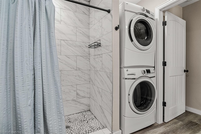 1701 W College St, Sherman, TX 75092 - laundry room with stacked washer / dryer, wood finished floors, and baseboards