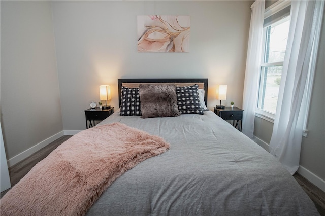 1701 W College St, Sherman, TX 75092 - bedroom featuring multiple windows and baseboards