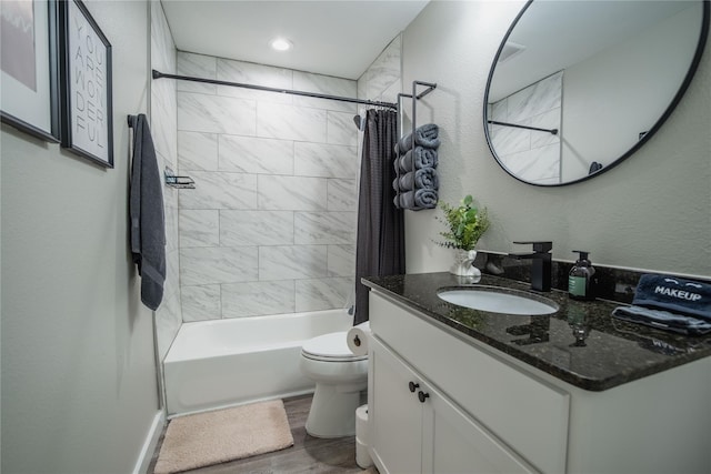 1701 W College St, Sherman, TX 75092 - bathroom with toilet, wood finished floors, vanity, and shower / bath combo