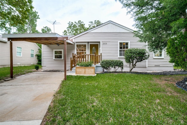 2839 Ruidosa Ave, Dallas, TX 75228 - view of front of house featuring driveway, a carport, and a front yard