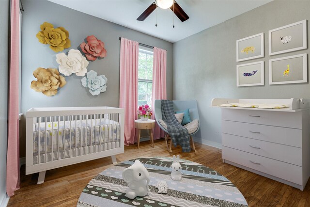 2839 Ruidosa Ave, Dallas, TX 75228 - bedroom with a nursery area, wood finished floors, baseboards, and ceiling fan