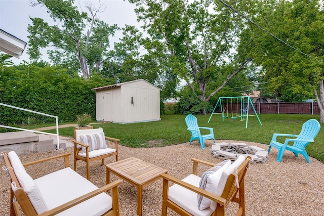 2839 Ruidosa Ave, Dallas, TX 75228 - view of patio with a fire pit, a playground, and view of wooded area