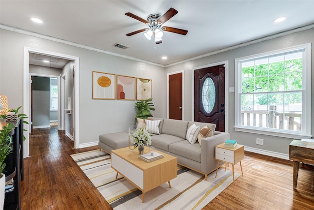 2839 Ruidosa Ave, Dallas, TX 75228 - living area featuring attic access, ceiling fan, healthy amount of natural light, wood finished floors, and ornamental molding