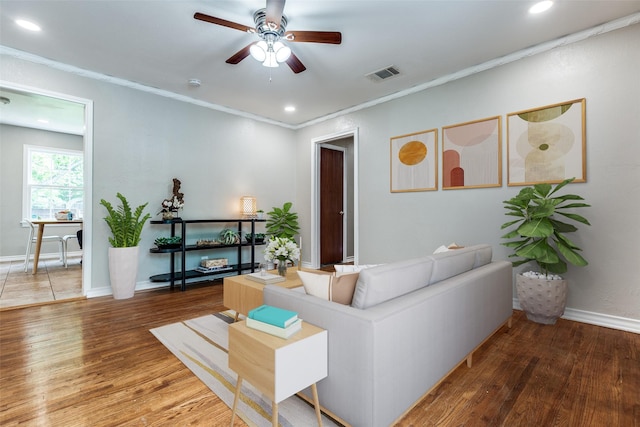2839 Ruidosa Ave, Dallas, TX 75228 - living room with wood finished floors, ceiling fan, recessed lighting, baseboards, and crown molding