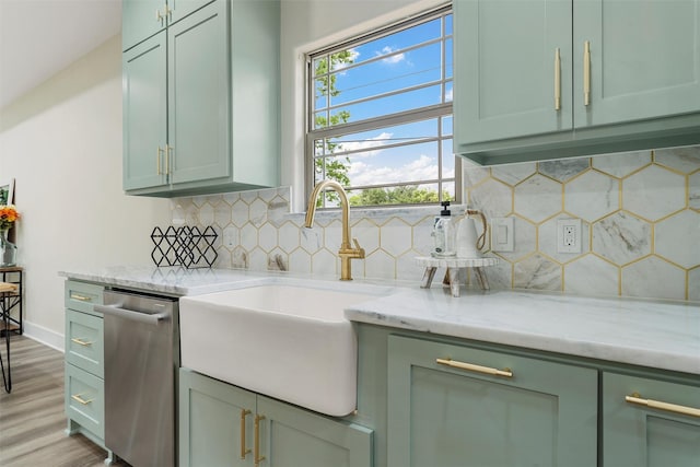 600 Arthur St, Mcgregor, TX 76657 - kitchen with dishwasher, green cabinetry, and a sink