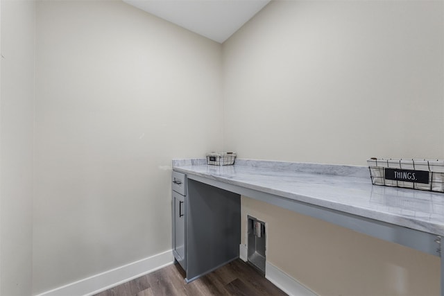 600 Arthur St, Mcgregor, TX 76657 - laundry area with dark wood finished floors and baseboards