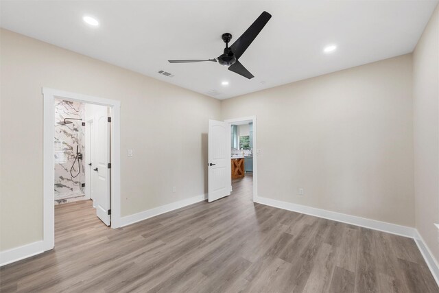 600 Arthur St, Mcgregor, TX 76657 - unfurnished bedroom featuring wood finished floors, baseboards, recessed lighting, and ceiling fan