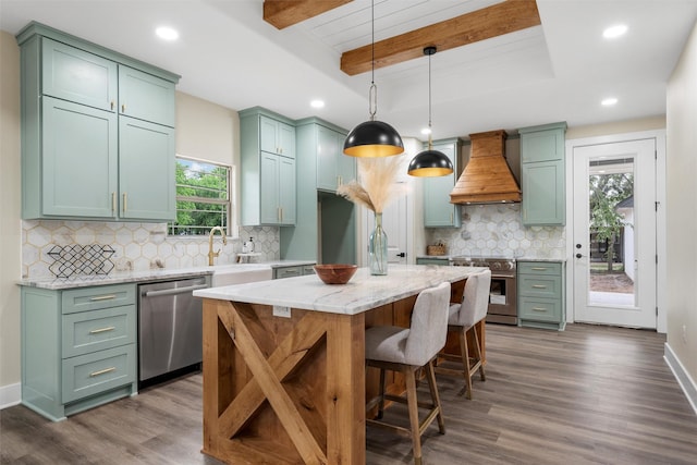 600 Arthur St, Mcgregor, TX 76657 - kitchen featuring custom range hood, appliances with stainless steel finishes, green cabinets, a sink, and dark wood-style floors