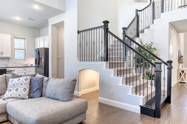 6108 Lipan Ln, Mckinney, TX 75070 - living room featuring dark wood-style floors, baseboards, stairway, and recessed lighting