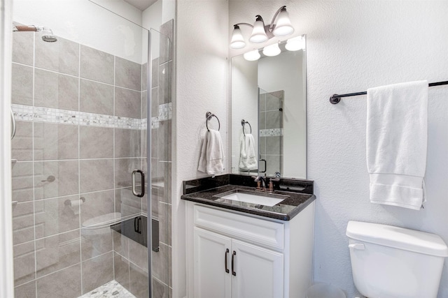 6108 Lipan Ln, Mckinney, TX 75070 - bathroom featuring a stall shower, vanity, toilet, and a textured wall
