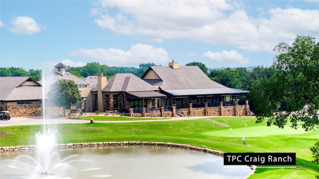 6108 Lipan Ln, Mckinney, TX 75070 - back of house featuring a lawn, a water view, and a putting area
