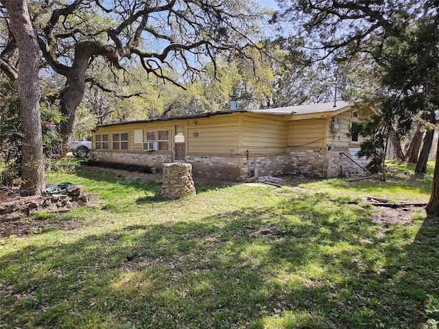 193 County Road 1704, Clifton, TX 76634 - back of property with a yard and brick siding