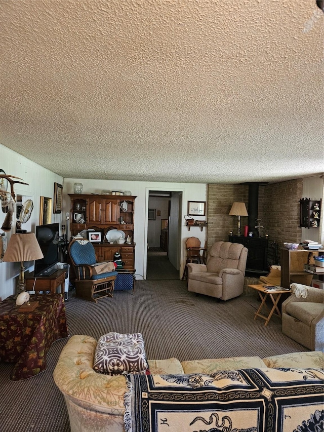 193 County Road 1704, Clifton, TX 76634 - carpeted living room with a textured ceiling and a wood stove