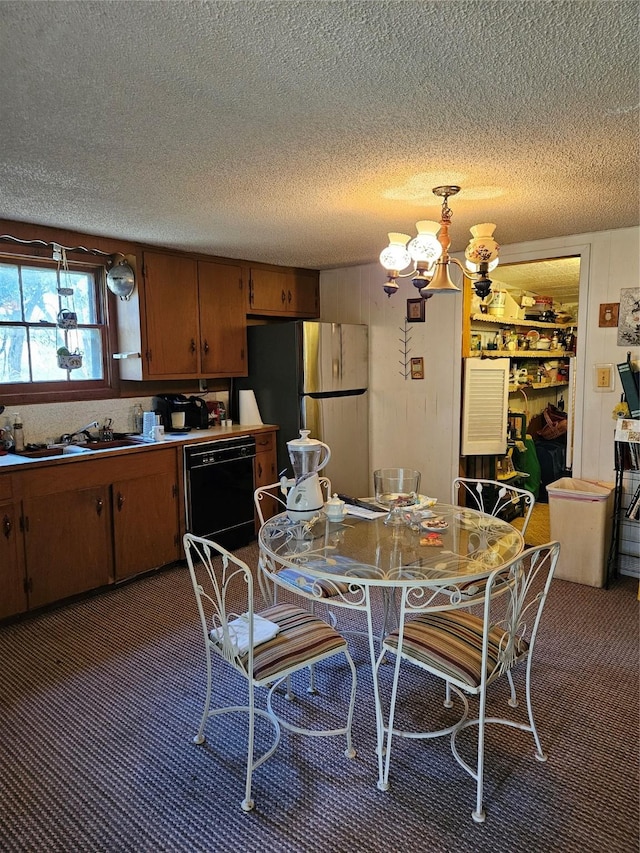 193 County Road 1704, Clifton, TX 76634 - carpeted dining room featuring a sink, a chandelier, and a textured ceiling