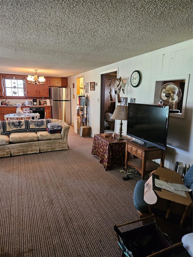 193 County Road 1704, Clifton, TX 76634 - living area with a chandelier, a textured ceiling, and carpet flooring