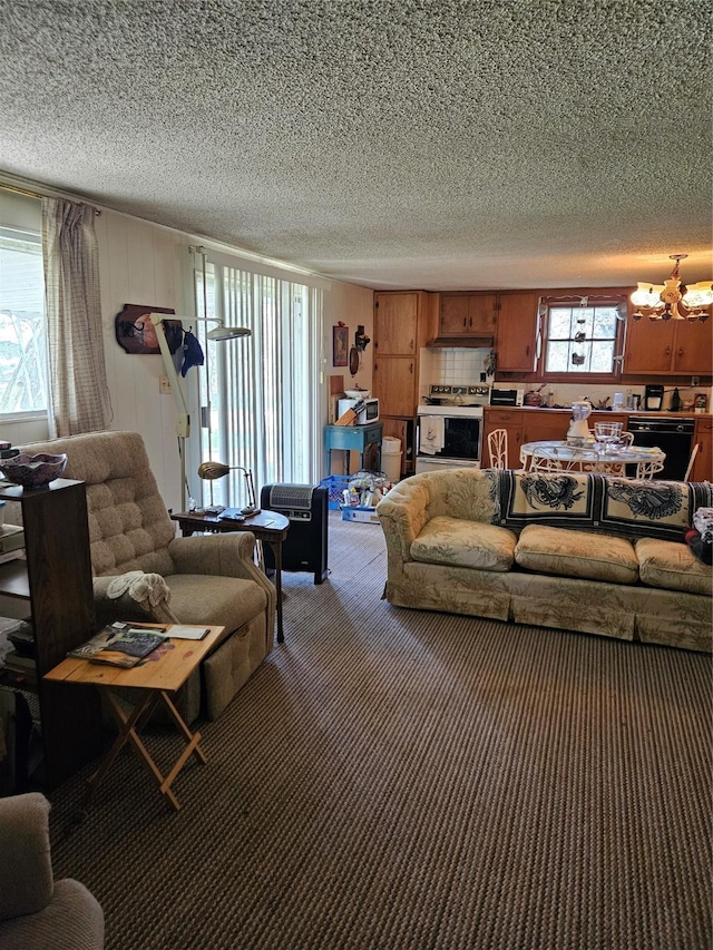 193 County Road 1704, Clifton, TX 76634 - living room featuring a chandelier, a textured ceiling, and carpet floors