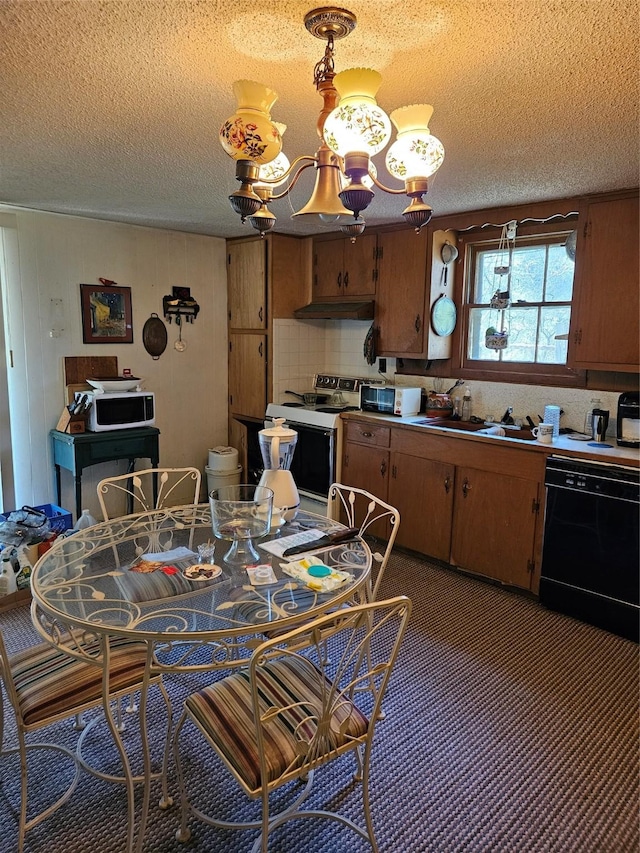 193 County Road 1704, Clifton, TX 76634 - carpeted dining room featuring a textured ceiling, a chandelier, and a sink