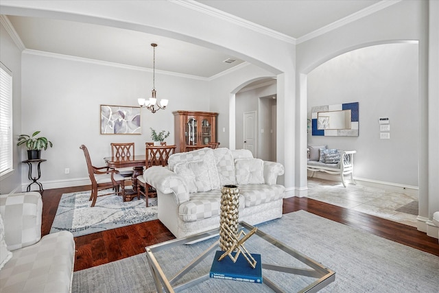 8001 Sutherland Ln, Plano, TX 75025 - living area with wood finished floors, crown molding, baseboards, arched walkways, and a chandelier