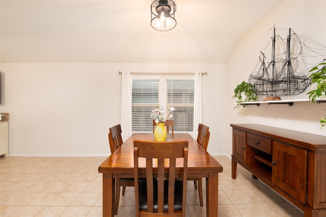 9332 Castorian Dr, Fort Worth, TX 76131 - dining room featuring lofted ceiling, light tile patterned floors, and baseboards
