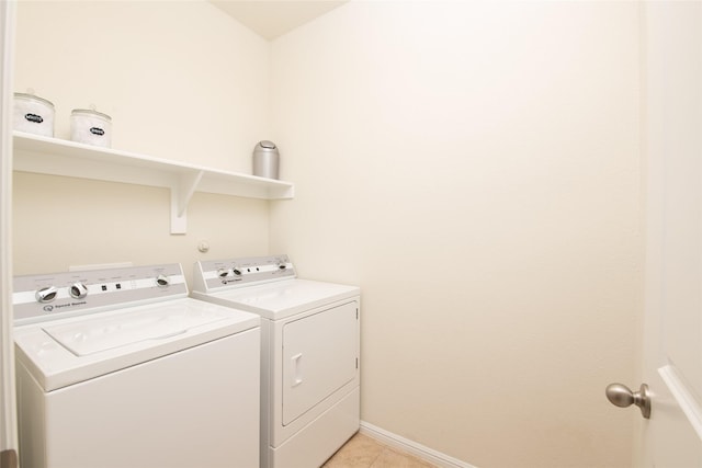 9332 Castorian Dr, Fort Worth, TX 76131 - laundry room with washing machine and dryer, light tile patterned floors, and baseboards