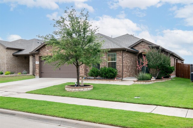 9332 Castorian Dr, Fort Worth, TX 76131 - french country style house featuring brick siding, concrete driveway, an attached garage, and roof with shingles
