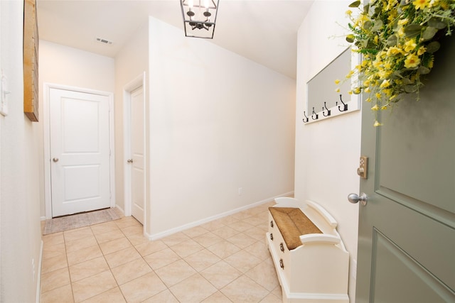 9332 Castorian Dr, Fort Worth, TX 76131 - mudroom with baseboards and light tile patterned floors