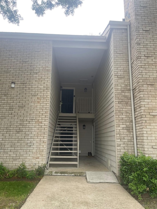 5881 Preston View Blvd Unit 121, Dallas, TX 75240 - doorway to property featuring brick siding