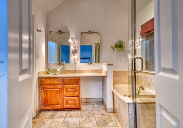 2514 Colquitt Rd, Terrell, TX 75160 - full bath with a garden tub, a shower stall, vanity, vaulted ceiling, and marble finish floors