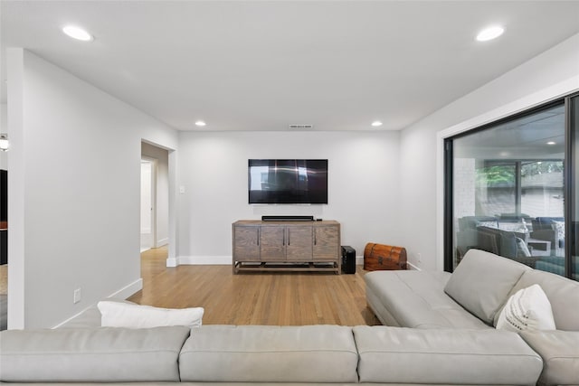 11641 Sasanqua Ln, Dallas, TX 75218 - living room with wood finished floors, recessed lighting, and baseboards