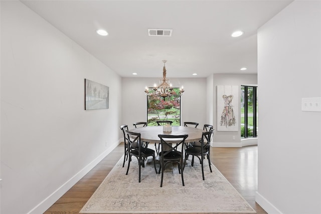 11641 Sasanqua Ln, Dallas, TX 75218 - dining space with baseboards, recessed lighting, wood finished floors, and a chandelier