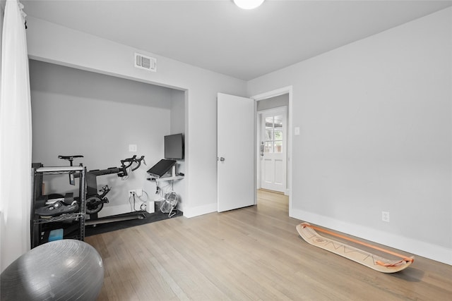 11641 Sasanqua Ln, Dallas, TX 75218 - exercise room featuring wood finished floors and baseboards