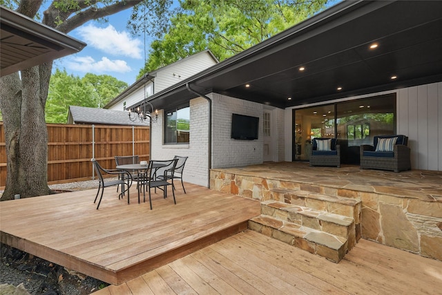 11641 Sasanqua Ln, Dallas, TX 75218 - wooden terrace with outdoor dining area and fence